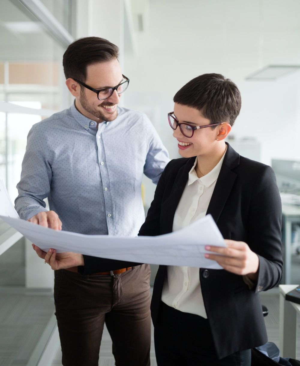 Business partners reviewing commercial mortgage documents